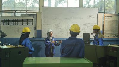 Works in hardhats having a meeting